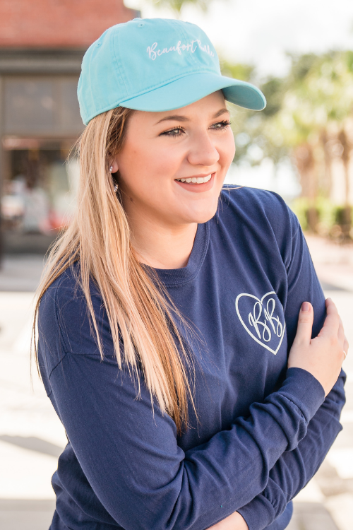 Baseball hat with hot sale ball on top